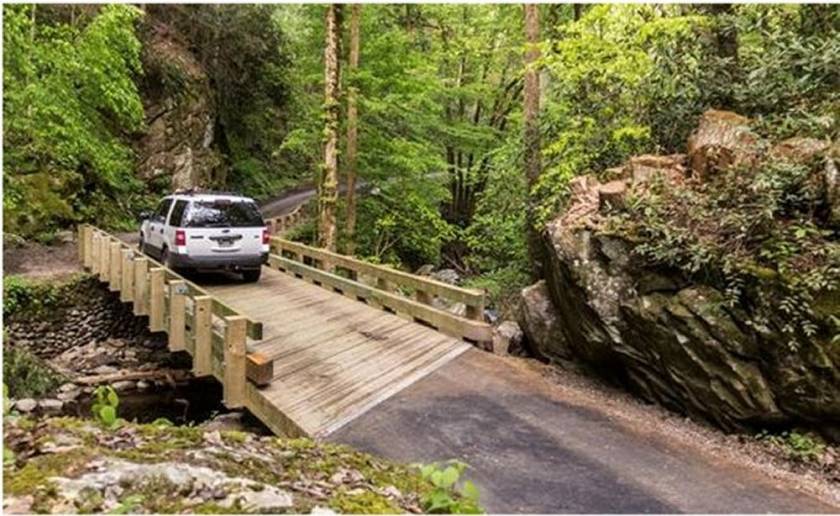 Car driving across bridge.